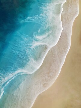 Top view on sea wave with white foam and light beige sand. Fluid, pour drawing of epoxy resin. Summer sunny beach painting, seascape, blue, azure, turquoise color of water, shore. 