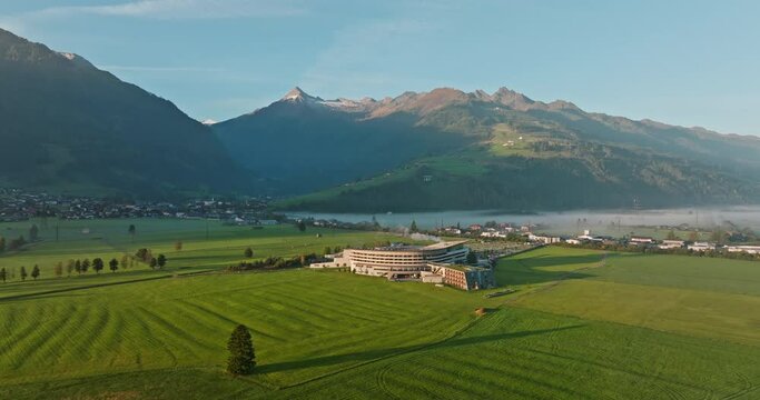 Townscape By The Lake And Towering Mountains