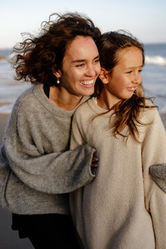 Mom and daughter on the beach