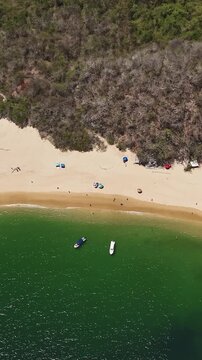 Vertical aerial hyperlapse of a beach in Huatulco, Oaxaca