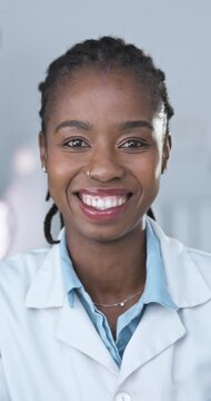 Scientist, lab and face of black woman with smile for medical experiment, healthcare and pride. Pharmaceutical, science and researcher with confidence for Mpox, vaccine and clinical trial in Nigeria