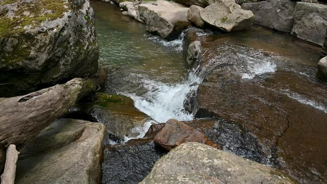 Small waterfall with water running over rocks