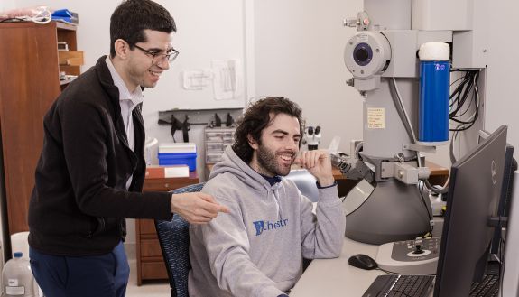 Duke chemist Ivan Moreno-Hernandez (left) and his Ph.D. student Avery Vigil (right) use a technique called liquid phase electron microscopy to watch chemical processes in action. Credit: Photo by Justin Cook.