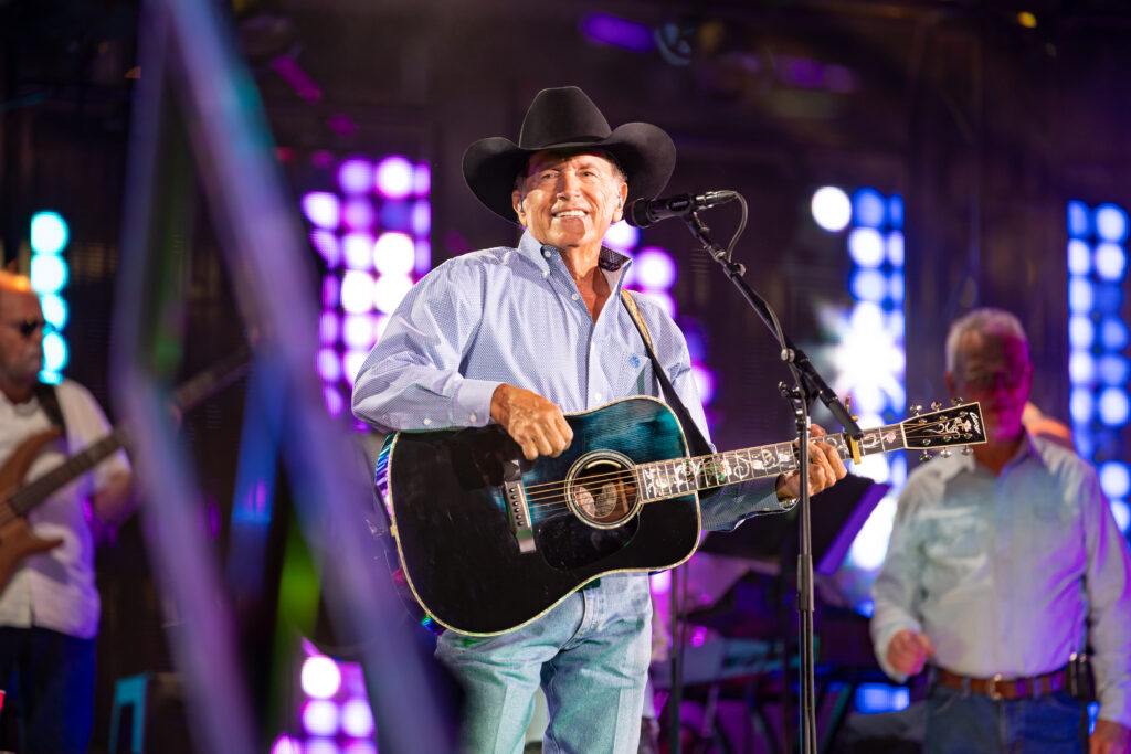 George Strait performs on stage at Kyle Field.