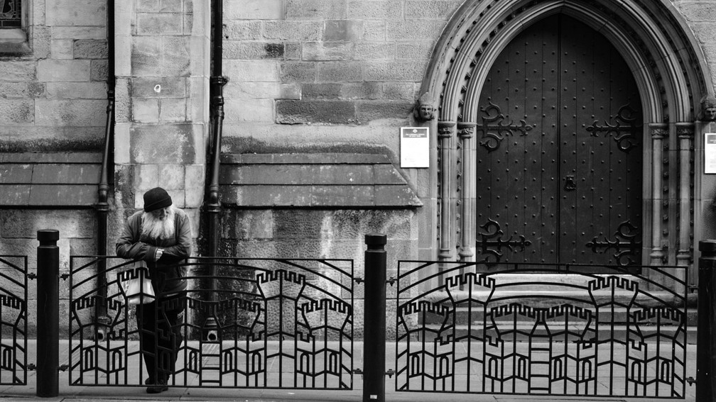 A man in front of a building.