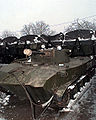 A Russian BMD-2 with SFOR markings parked in front of several trailer units at the Russian airborne brigade stationed in Tojsici, Bosnia-Herzegovina, 1 January 1996.