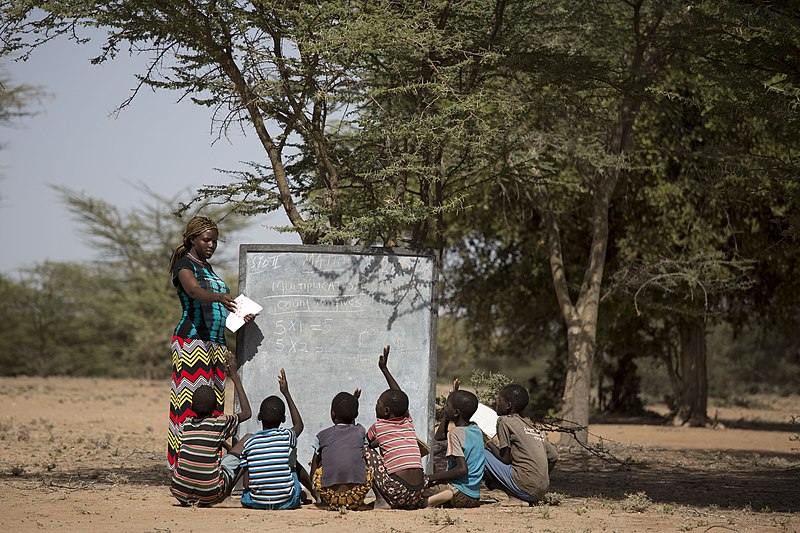 File:African teacher teaching under a tree.jpg