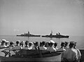 Sailors from Warspite look on as ships of the surrendered Italian fleet slowly steam into internment at Malta, 10 September 1943.