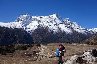 A porter carrying a heavy load in the Everest region, Nepal