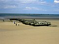 Concrete blocks that the formed provisional port on the beach of Arromanches