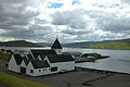 The church of 1927 was modernized and expanded in 1981. View westwards over the fjord.