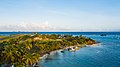 Aerial view of a beach on Union Island near Clifton with the Union Island Airport in the background. December 2018.