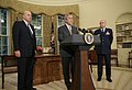President George W. Bush announces his nomination of Gen. Michael V. Hayden as the next Director of the Central Intelligence Agency Monday, May 8, 2006, in the Oval Office as Ambassador John Negroponte, Director of National Intelligence, looks on.
