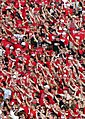 Texas Tech fans doing the Guns Up hand sign