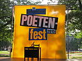 * Nomination: Erlanger poetry festival 2015, main stage --Kritzolina 20:56, 19 November 2023 (UTC) * Review Blurred, sky blown out, desk pitch black, overall lack of sharpness and detail, plus perspective distortion ... --Plozessor 06:31, 20 November 2023 (UTC)