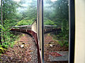 Reflections in the windows of the carriages.