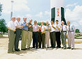 English: Members of the original von Braun German rocket team participate in the Saturn V replica dedication ceremony. Pictured are left to right: Walter Jacobi, Konrad Dannenberg, Apollo 14's Edgar Mitchell, NASA Administrator Dan Goldin, Apollo 12's Dick Gordon, Gerhard Reisig, Werner Dahm, Marshal Director Art Stephenson, Director of the U. S. Space and Rocket Center Mike Wing, Walter Haeusserman and Ernst Stuhlinger.