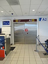 San Juan — Luis Muñoz Marín International Airport (inside door to Gate A2 for employees)