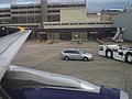 Airbus A321-200 G-OZBT wing view at Manchester Airport Gate 22, awaiting departure on a flight to Malaga