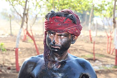 A Rathwa tribesman with oil painted body