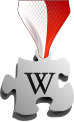 * Nomination Wikimedal, with polish-flag colors texture on ribbon. Symbol of Featured Article on Polish Wikipedia. By User:Halibutt --Piotr Bart 00:22, 4 May 2019 (UTC) * Decline  Oppose The diagonal pattern does not mach the shading --MB-one 12:01, 4 May 2019 (UTC)