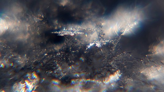 Snow crystals glittering in strong direct sunlight