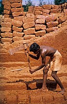 Cutting of laterite brickstones, Angadipuram, India