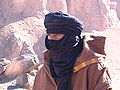 A Tuareg man wearing a tagelmust (or cheche), headgear combining a turban and a veil