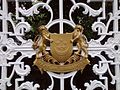 The coat of arms of Singapore in gold, mounted on the gate of the Istana which is the official residence of the President of Singapore