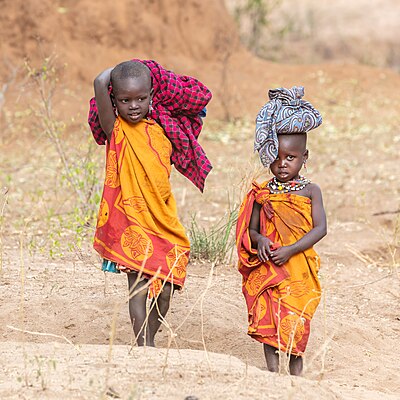 Kids of the Laarim tribe walking around their village in Kimotong, South Sudan.