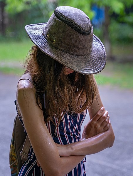 File:A girl standing in the rain.jpg