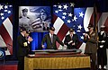 Bush viewing a model of the USS George H. W. Bush (CVN-77), 2002