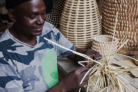 Zimbabwean Artist weaving a Victorian Wave basket.