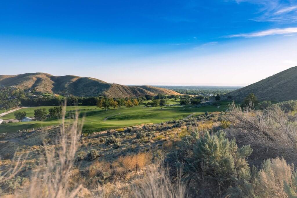 A view of the lush and scenic landscapes at Quail Hollow Golf Course.