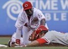 Chase Utley is tagged out at second by the Reds´ Brandon Phillips in the fourth inning. Utley hurt his right thumb on the play and will undergo an MRI on Tuesday.