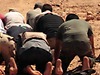 Libya rebels praying