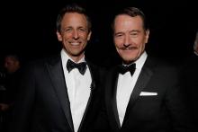 Seth Meyers (l) of Late Night with Seth Meyers and Bryan Cranston (r) of Breaking Bad at the 66th Emmy Awards.