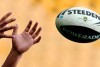 An NRL player catches a ball during training.