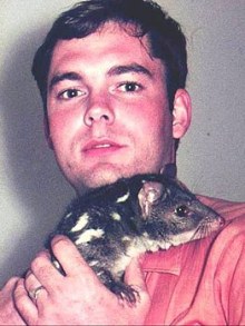 Mike Archer cradles a quoll