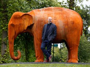 4 September 2015: Artist Kenny Hunter unveils a life-size Asian elephant sculpture, cast in part from scrap locomotive parts from the nearby Govan shipyards, at Bellahouston Park in Glasgow. A year in the making, the 11 tonne sculpture is part of the Legacy 2014 project commemorating the city's hosting of the Commonwealth Games last year
