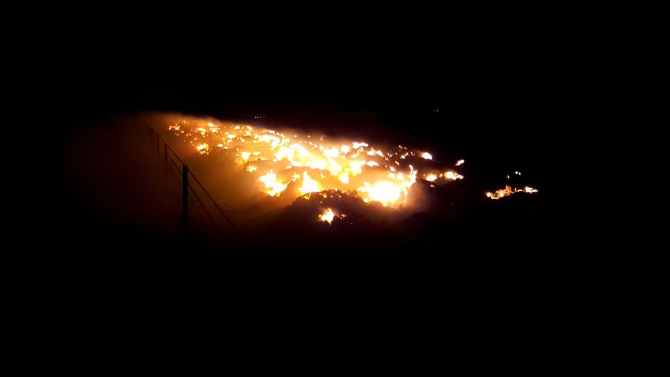 Fire burns at a farm