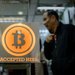 A shop in Hong Kong that accepts the digital currency Bitcoin. Bitfinex, a Bitcoin exchange based in the city, said that any outstanding settlements would be made at the price before it reported the hacking.