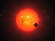 Экзопланета Gliese 1214 b на фоне звезды GJ 1214