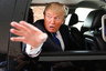 Real estate magnate Donald Trump waves as he leaves a Greater Nashua Chamber of Commerce business expo at the Radisson Hotel in Nashua, New Hampshire, May 11, 2011. Trump suggested Wednesday it's not much fun flirting with the idea of running for president in the face of relentless attacks and ridicule. REUTERS/Don Himsel/Pool (UNITED STATES - Tags: POLITICS)