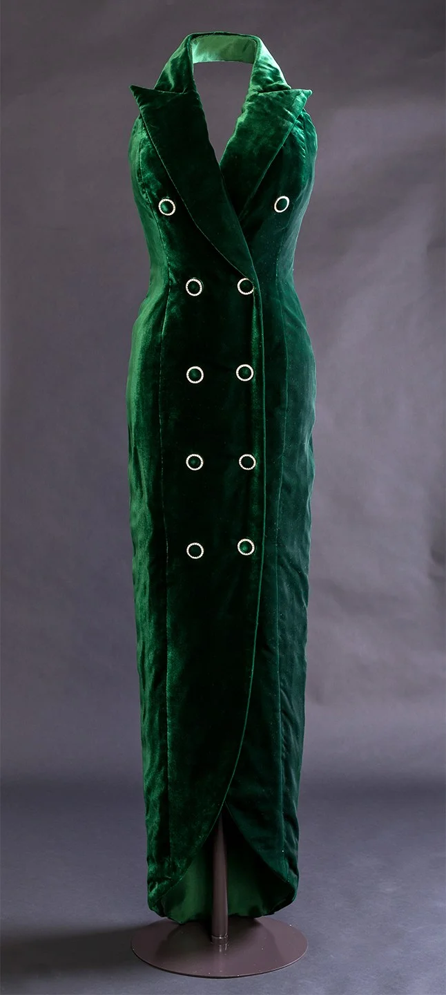 A green velvet halter neck dress by Catherine Walker
