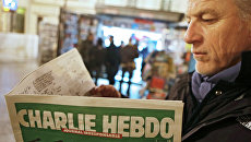 Первый после теракта номер номер французского сатирического еженедельника Charlie Hebdo