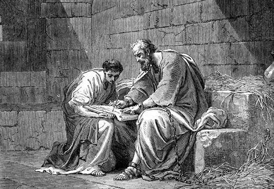 Paul the Apostle in prison, writing his epistle to the Ephesians.