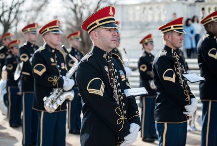 The U.S. Army Band (Pershing's Own), supports a full honors wreath laying ceremony hosted by Gen. François Lecointre, chief of defence staff, French Armed Forces, at the Tomb of the Unknown Soldier, Arlington National Cemetery, Arlington, Va., Feb. 12, 2018. Lecointre visited ANC as part of his first official visit, touring the Memorial Amphitheater Display Room and meeting with ANC Senior Leadership.