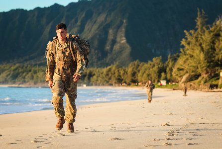 Soldiers with the 94th Army Air and Missile Defense Command, perform a tactical beach road march on Bellows Air Force Station, Waimanalo, Hawaii, March 27, 2018. The week long competition tested the Soldiers during individual and team competitive events.