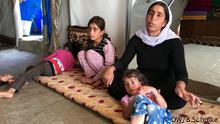 Irak, Jesidin Kocher mit drei ihrer Töchter. Sie war mit ihren Kindern zwei Jahre in IS-Gefangenschaft.